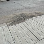 Debris on Street, Sidewalk, Boulevard at 2004 34 Av SW