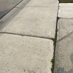 Sidewalk or Curb - Repair at 155 Saddlelake Wy NE