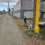 Debris on Backlane at 611 67 Av SW