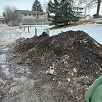 Debris on Backlane at 222 Ranchlands Co NW