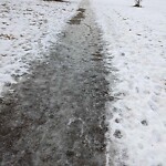 Snow On City - Maintained Sidewalk at 1935 29 St SW