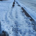 Snow On City - Maintained Sidewalk at 915 Parkvalley Wy SE