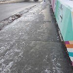 Snow On City - Maintained Sidewalk at 303 9 Av SE