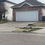 Debris on Street, Sidewalk, Boulevard at 34 Hidden Ranch Bv Nw, Calgary, Ab T3 A5 N6