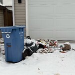 Debris on Backlane at 128 Mt Allan Ci SE